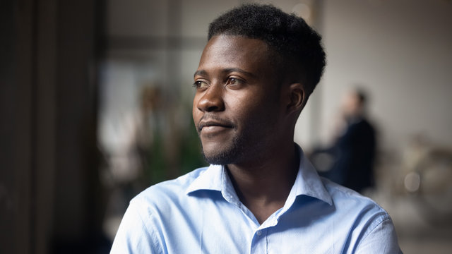 Head Shot Close Up Young Thoughtful African American Businessman.