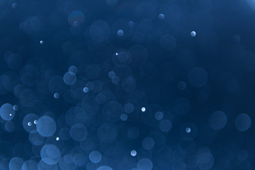 abstract sparkle bokeh light effect with navy blue background