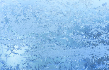 Beautiful winter texture of hoar frost on  window frozen glass.