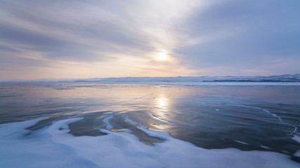 Sunrise over the frozen lake Baikal
