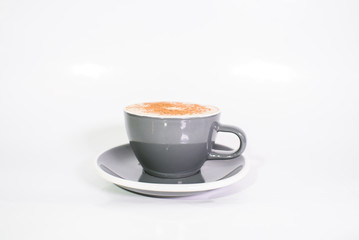 Cup of fresh cappuccino on a white background. The drinks.
