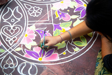girl making rangoli - indian mandala. Indian traditional culture, art and religion. abstract mandala Oriental background, , copy space. top view