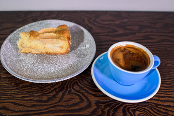 Charlotte of pears and cappuccino on a white background