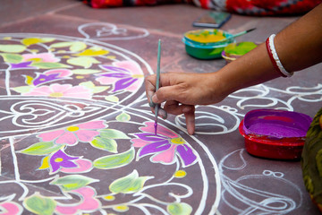 Rangoli- an Indian traditional power drawing. Indian traditional culture, art and religion. abstract mandala Oriental background,