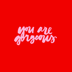 Minimalist vector lettering. Hand drawn inscription on red background. You Are Gorgeous inspirational quote.