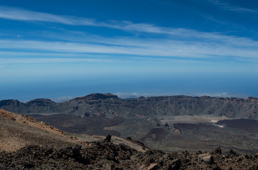 View from the peak of Mount Teide on the Island of Tenerife showing the deep blue sky