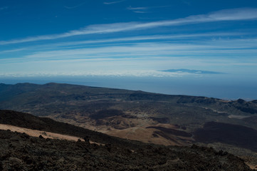 View from the peak of Mount Teide on the Island of Tenerife showing the deep blue sky