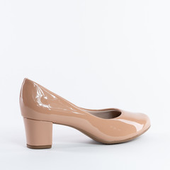 Beautiful patent leather women's shoes in beige. On white background. heels. Choose other angles of this boot and new models in my profile