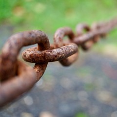 old metallic brown chain abandoned on the street