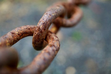 old metallic brown chain abandoned on the street