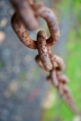 old metallic brown chain abandoned on the street