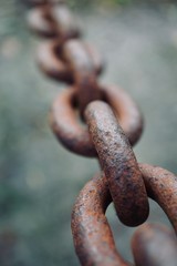 old metallic brown chain abandoned on the street