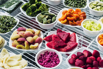 fresh-frozen berries, fruits and vegetables in the shop window or in the market