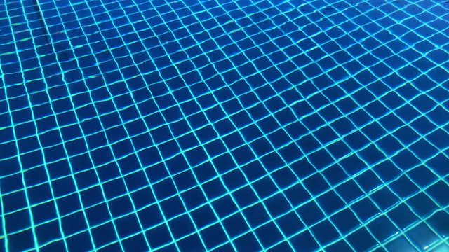 smooth waving dark blue swimming pool motion footage background.