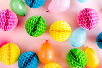 Balloons and confetti on pink background.  Birthday, holiday concept. Flat lay, top view. Birthday party background