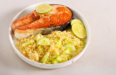 Lime salmon steak with bulgur salad