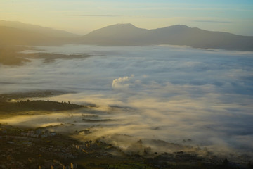Fog and pollution from a mountain view at the sunrise