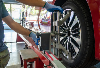 Wheel alignment ,Grid sensor sets mechanic on auto. Car stand with sensors wheels for alignment...