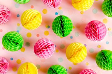Balloons and confetti on pink background.  Birthday, holiday concept. Flat lay, top view. Birthday party background