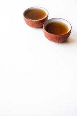 Black tea cups isolated on white background