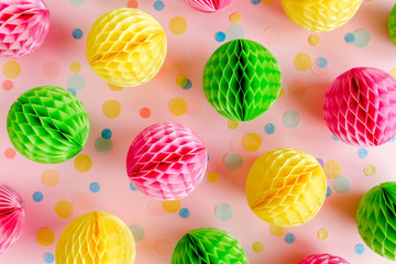 Balloons and confetti on pink background.  Birthday, holiday concept. Flat lay, top view. Birthday party background