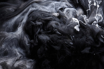 Abstract black and white swirling smoke background. Cumulus thunderclouds, mysterious and...