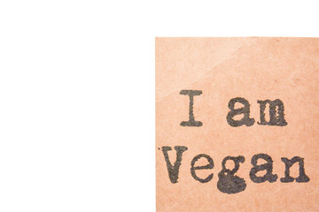 I am Vegan label on a white background. Brown paper label, black letters and lots of copy space