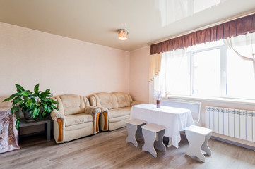 Russia, Moscow- July 23, 2019: interior room apartment. standard repair decoration in hostel. kitchen, dining area