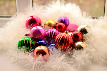 Christmas colorful shiny Cristmas balls with shimmering garland and fluffy decor