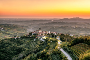 Goriska Brda a famous wine region of Slovenia located near Italy. Sunrise and sunset looking over Smartno village  - obrazy, fototapety, plakaty