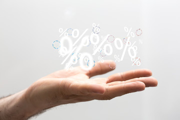 hand touches virtual percent icon