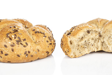 Group of one whole one half of sesame kaiser roll isolated on white background