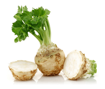 Fresh celeriac with leaf isolated on white