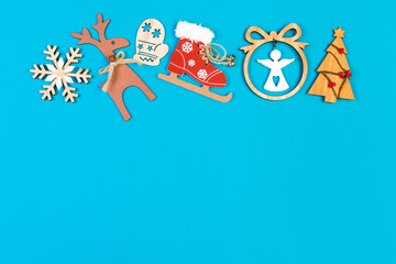 Top view of holiday ornament made of Christmas decorations on colorful background. New Year time concept with copy space