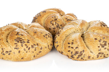 Group of three whole sesame kaiser roll isolated on white background