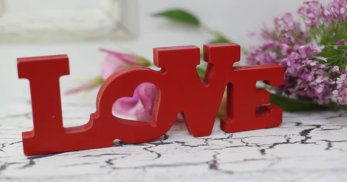 wedding table decoration with flowers, flower decoration wedding table, wedding florist, wedding at the table is Pano with letters and monograms, rose flowers and white orchid