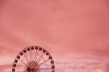 Carousel against dramatic sky
