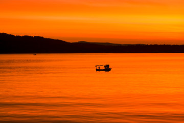 lonely boat and sunset