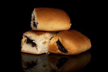 Group of three whole sweet czech bun isolated on black glass