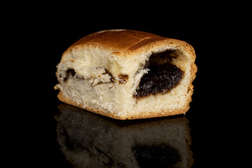 One whole sweet czech bun isolated on black glass