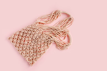 Fototapeta premium Reusable shopping bags, eco bag on pink background. No waste, no plastic. Flat lay, top view 