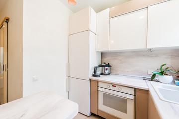 Russia, Moscow- July 23, 2019: interior room apartment. standard repair decoration in hostel. kitchen and dining room