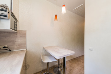 Russia, Moscow- July 23, 2019: interior room apartment. standard repair decoration in hostel. kitchen and dining room