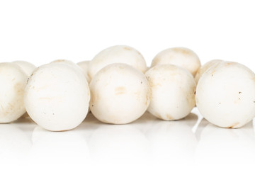 Lot of whole fresh white champignon isolated on white background