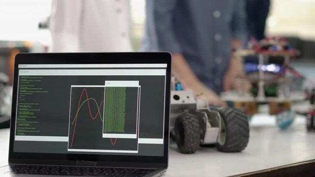 Laptop show motion graphic of data generate and synchronize processing update real time.