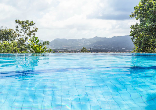 private luxury infinity pool looking out over at tropical nature view background
