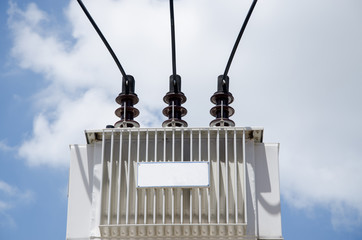 Transformer set on high with blue sky background.