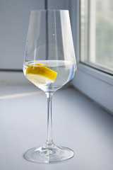 lemon water in a wine glass