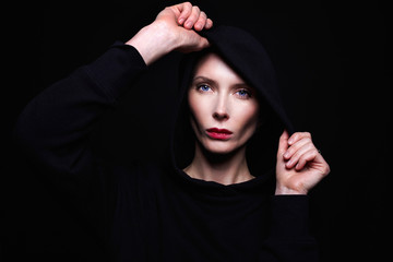 beautiful woman in hood. red lips and blue eyes