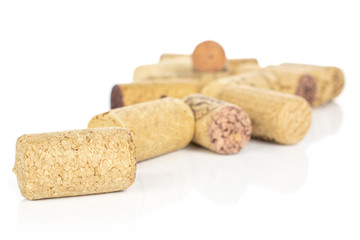 Lot of whole common wine cork front focus isolated on white background